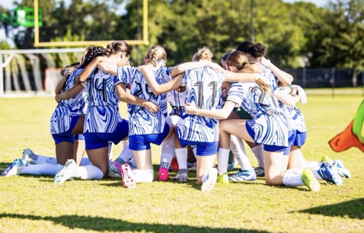 A DME Academy Sarasota team together on the field
